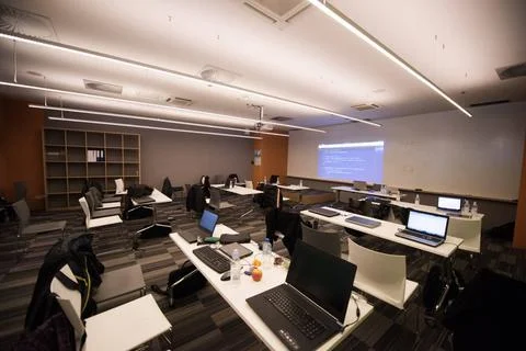 Empty it classroom empty it classroom with program code on projector scree... Photos