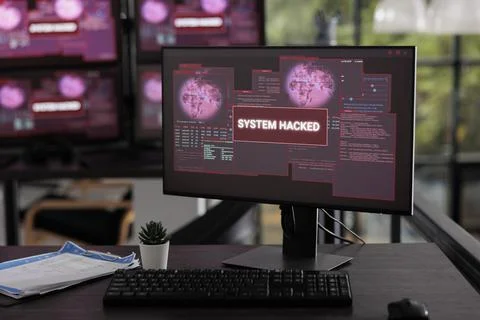 Empty it office having multiple computers flashing hacking alert 写真素材