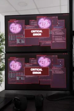 Empty it office with multiple monitors having hacking attack alert Stock Photos