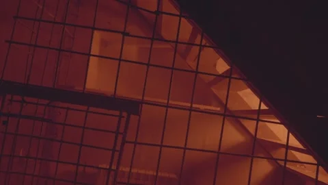 Empty jail cell. Prison. Horror or halloween concept. Orange electric light Stock Footage 238661535