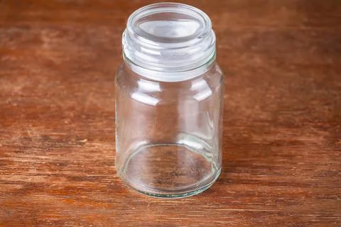 Empty jar dark wooden background savings. Stock Photos