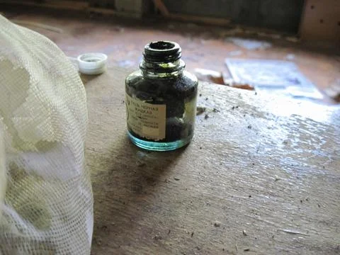 Empty jar of old inkwell on the table. Stock Photos