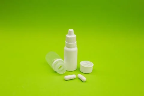 Empty jars, tubes, bottles on a green background Stock Photos