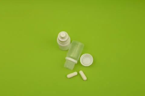 Empty jars, tubes, bottles on a green background Stock Photos
