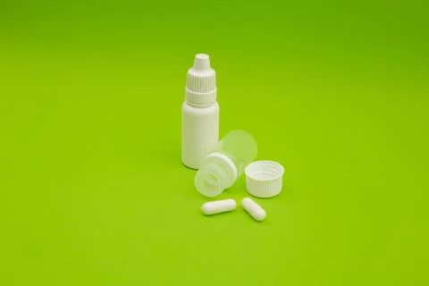 Empty jars, tubes, bottles on a green background Stock Photos