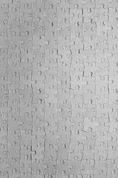Empty jigsaw puzzle pattern in grey color Stock Photos