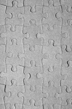 Empty jigsaw puzzle pattern in grey color Stock Photos