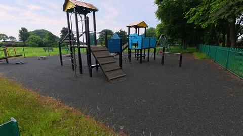 Empty Kids Playground With Climbing Frame And Swings In Quiet Local Park Stock Footage 338127932