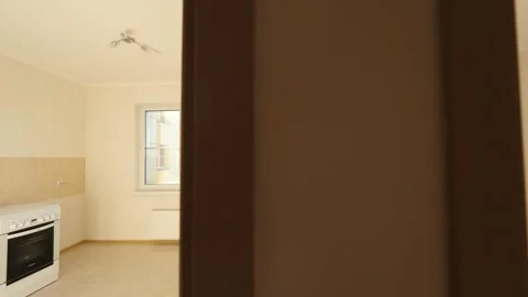 Empty kitchen and room in an apartment in a new building Video stock 244659007