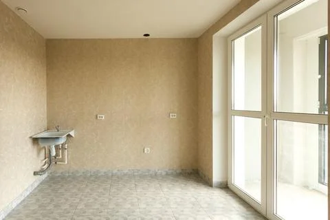 An empty kitchen with a budget clean renovation in a new apartment Stock Photos