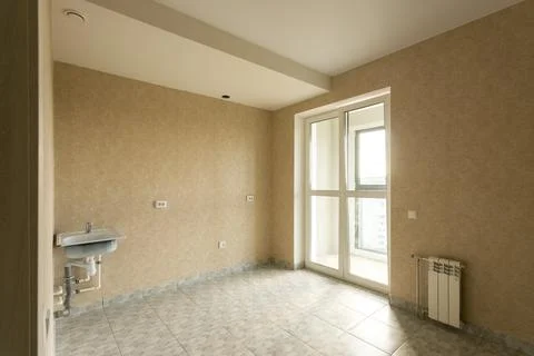 An empty kitchen with a budget clean renovation in a new apartment Stock Photos