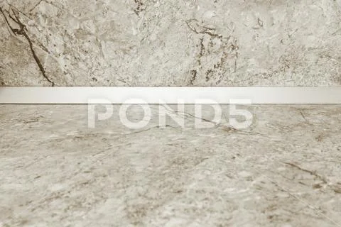 Empty kitchen countertop and a wall of light marble. Mockup to showcase your Stock Photos
