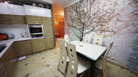Empty kitchen with dinner table, fridge in apartment Video stock 80530917