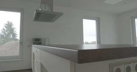 Empty Kitchen With Wooden Worktop and Island Hood, New Build Interior, Slow Pan Video stock 340360680