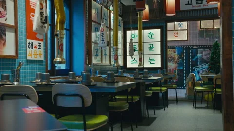 Empty Korean BBQ Restaurant Interior with Table Grills Vidéo 329598803