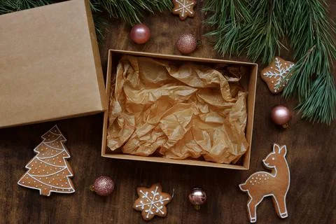 Empty kraft box with brown lid for sweets, cookies on New Year's table with Stock Photos