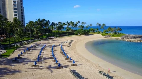 Empty lagoon resort pan right,  Lady taking a selfie on beach Video stock 89891319