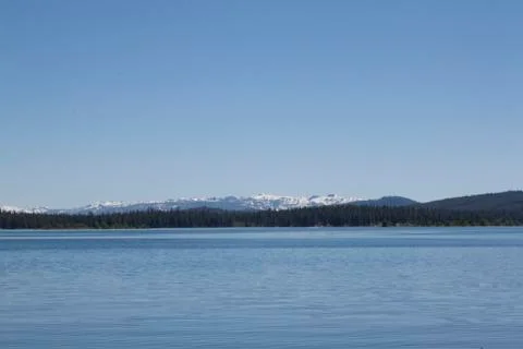 Empty lake with calm water surface Stock Photos