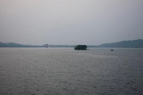 A empty lake with small waves flowing Stock Photos