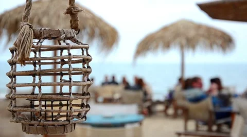 Empty lamp in a beach bar or cafe is swinging on a sea breeze on a seaside Stock Footage 63052184