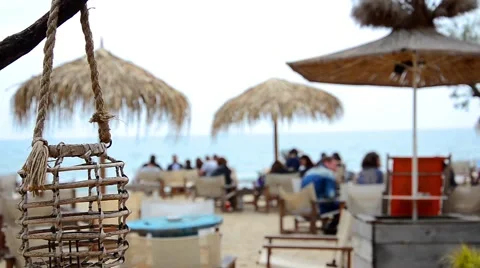Empty lamp in a beach bar or cafe is swinging on a sea breeze on a seaside Stock Footage 63052186