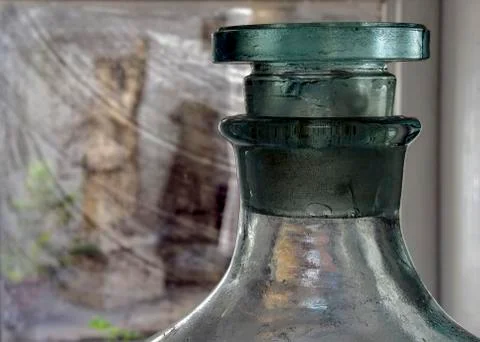 An empty large glass bottle ready to fill with young wine.     Foto stock