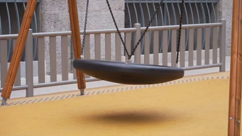 Empty large round swing swaying Stock Footage 273838852