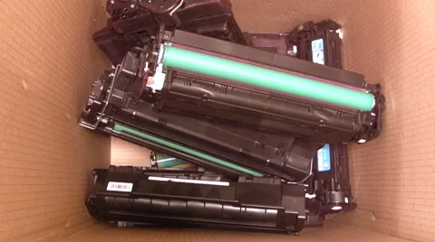 Empty Laser Printer Toner Cartridges being put in a recycling bin - stop motion. Video stock 41890553