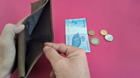 Empty leather wallet showing scarcity with brazilian currency video animation Stock Footage 341438834
