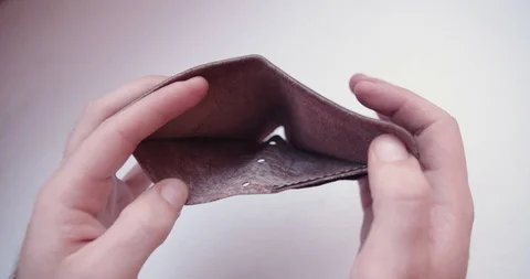 Empty leather wallet on white background covid 19 pandemic crisis Vídeo Stock 127925582