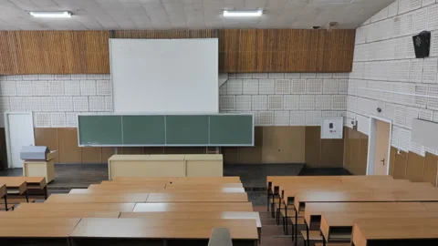 Empty Lecture Hall With Chalkboard And Rows Of Desks With Chairs Stock Footage 265167327