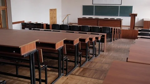 Empty lecture hall. Large blackboard, microphone, wooden furniture Stock Footage 70371340