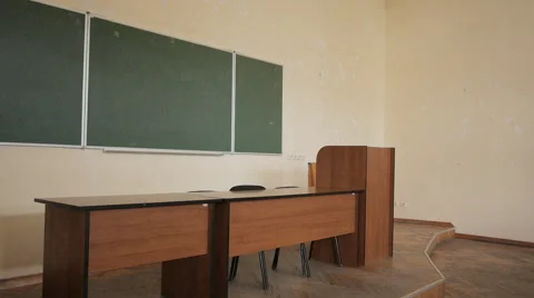 Empty lecture hall at the university. Rostrum, blackboard and teacher's desk. Stock Footage 68965893