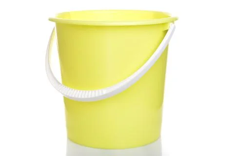 Empty lemon-colored plastic bucket with white handle on isolated background Stock Photos