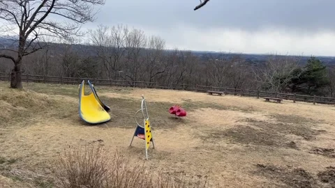 Empty Lifeless Park with Yellow Slide 스톡 동영상 344964332