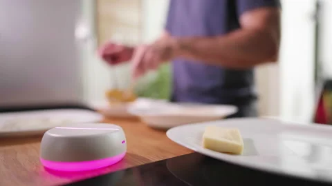Empty light base hologram with person in background cooking in kitchen 4K 스톡 동영상 208642881