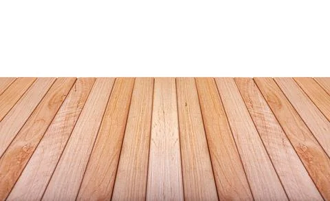 An empty light brown wooden table surface is shown in perspective against a Photos