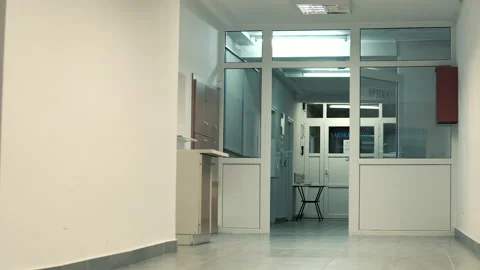 Empty light corridor in hospital, open door and table on the end, nobody Stock Footage 142618425