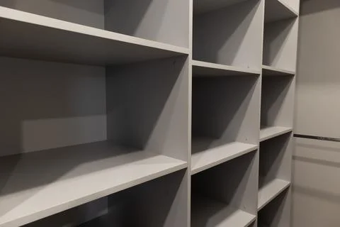 Empty Light Gray Shelves in a Walk in Closet Ready to Be Organized Stock Photos