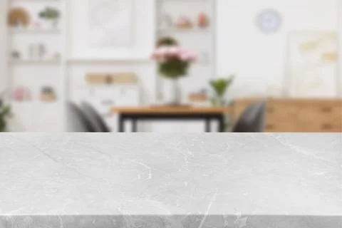Empty light grey marble table in dining room. Space for design Stock Photos