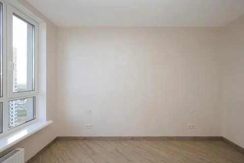 Empty light room with window in apartment interior 写真素材