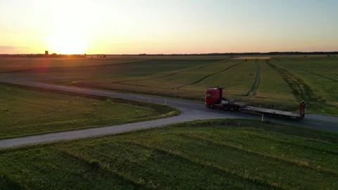 Empty loaded truck driving with a view of sunset Stock Footage 257818235