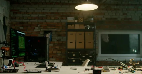 Empty Loft Office of Electronics Workshop at Night. Workspace with Computers Stock Footage 153877071