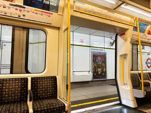 Empty London, UK Underground train interior at Embankment station with patt.. Stock Photos