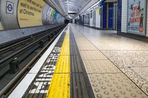 Empty London Underground Platform with Yellow Safety Line. London, UK, 26 Stock Photos