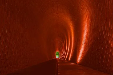 Empty long arched brick pedestrian tunnel, Prague Stock Photos