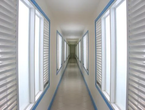 Empty long corridor in hotel Stock Photos