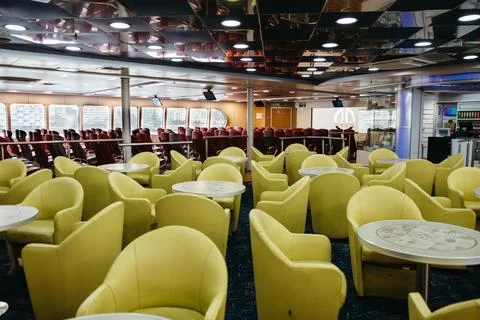 Empty lounge and seating areas inside a modern ferry Foto stock