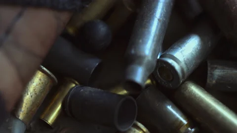 The empty machine gun shells.  Stock Footage 142627210