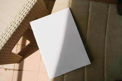 Empty magazine mockup on plastic table tile floor in the room, shadow overlay Stock Photos